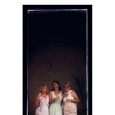 photograph of three ladies at a wedding reception