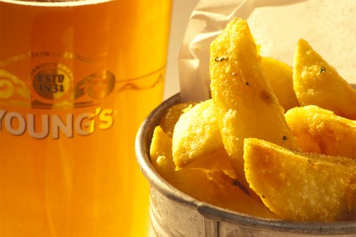 photograph of a pint of beer and chips